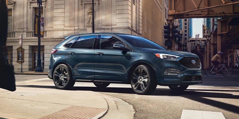 2023 Ford Edge driving down city street