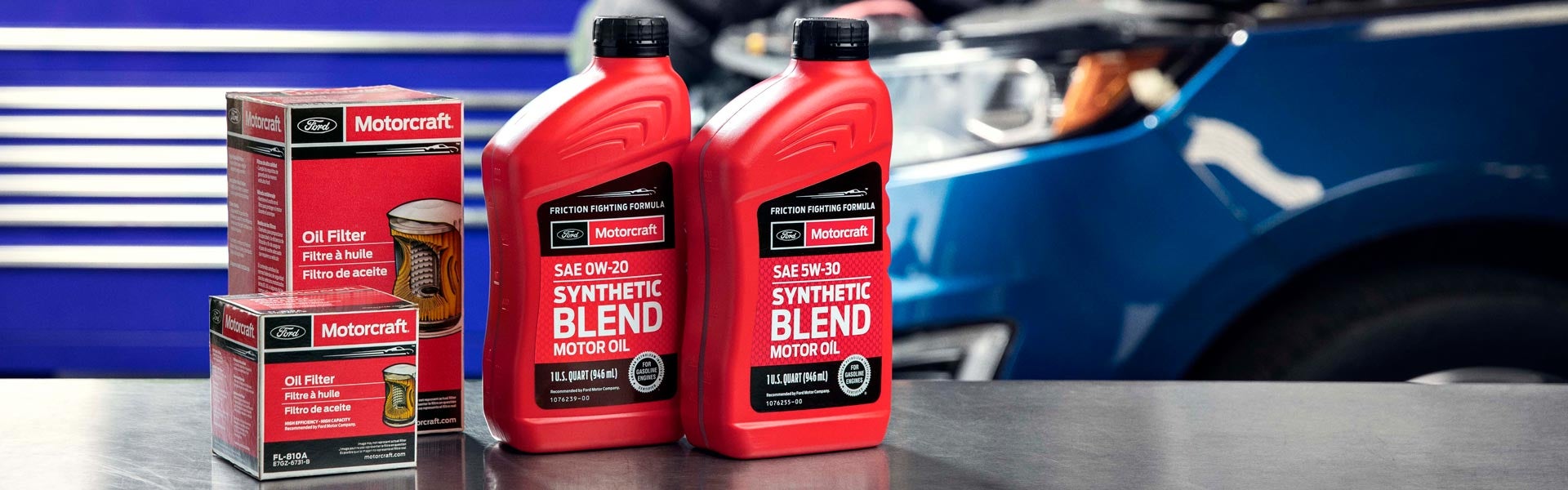 Red bottles of Ford Synthetic oil for oil change on vehicle